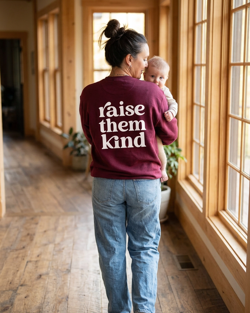 Burgundy Raise Them Kind walking with baby
