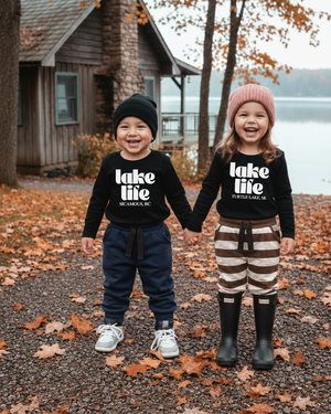 Children wearing navy and brown-striped pocket joggers with flat black drawstrings