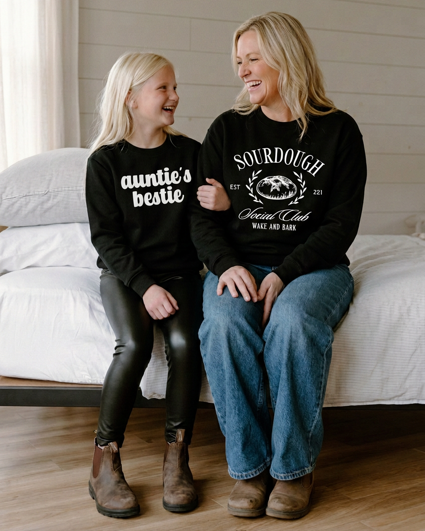 Two girls with the chunky Auntie’s Bestie font beside the woman in the Bookaholic crewneck