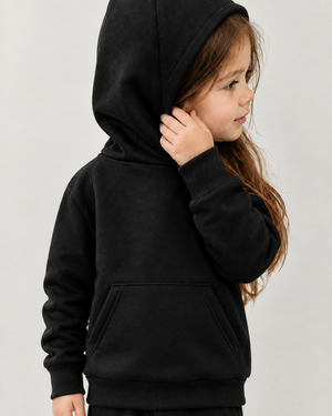 Girl in a black hoodie with corrected arm and front kangaroo pocket