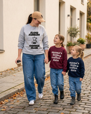 Mom in Adidas Sambas with her hat lowered, and daughters in black and grey boots